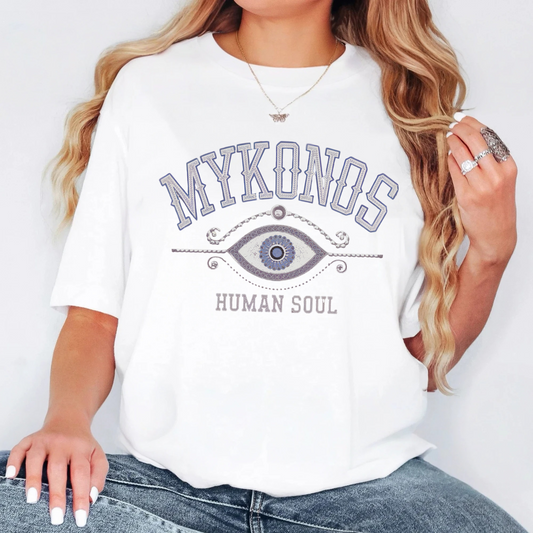 Mykonos Evil Eye T-Shirt featuring a minimalist Greek-inspired protection symbol, perfect for travel and spiritual wear.
