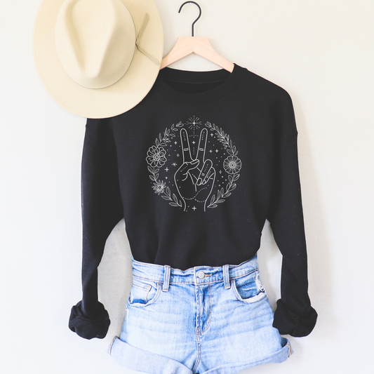 Celestial Peace Fingers Sweatshirt featuring cosmic and botanical elements, perfect for a boho spiritual aesthetic.