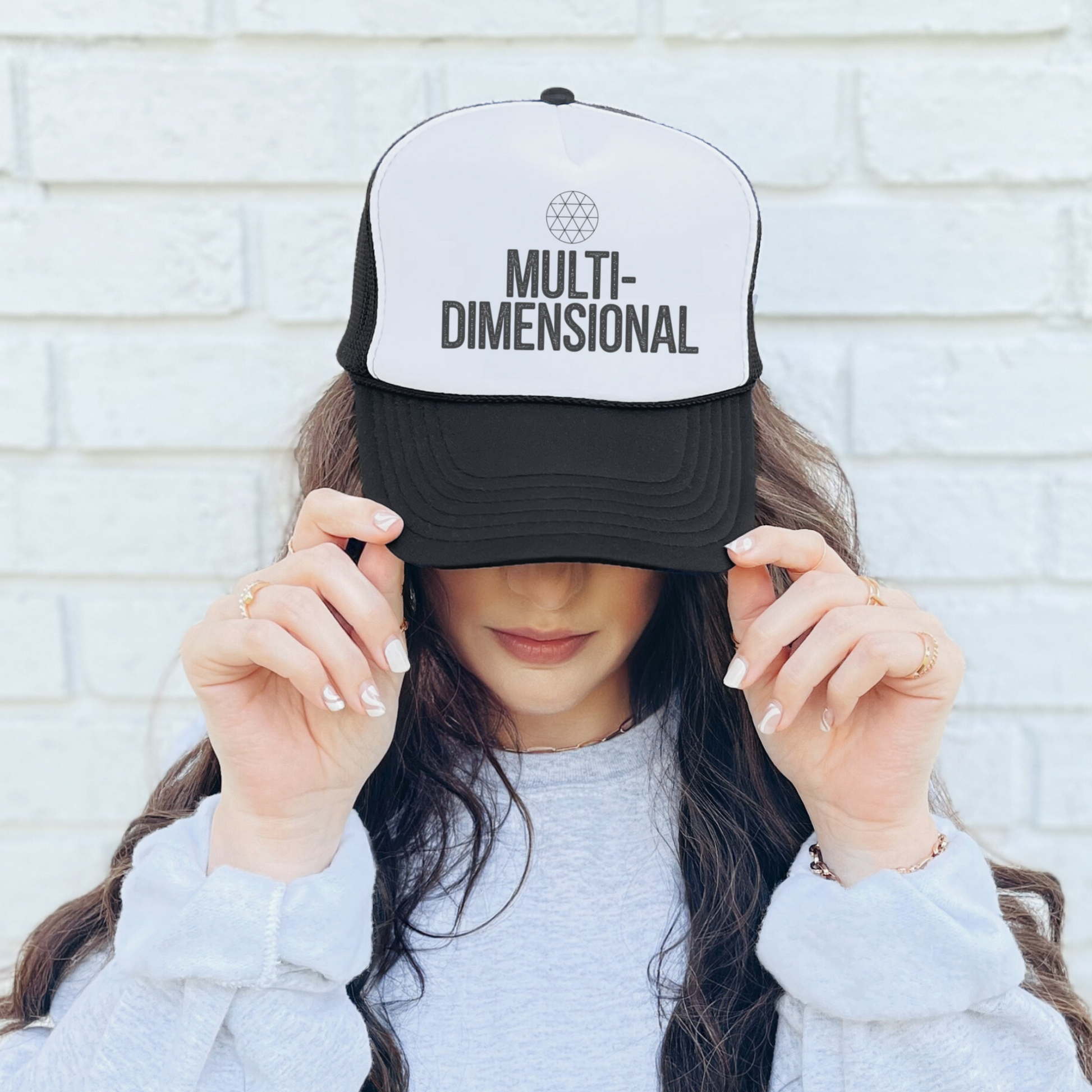 Multidimensional mesh trucker hat with sacred geometry symbol, designed for cosmic thinkers and spiritual seekers.