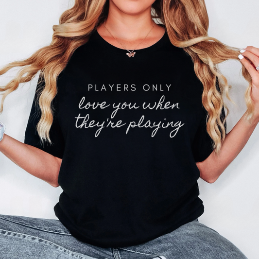 Women's t-shirt featuring 'Players Only Love You When They're Playing' text, inspired by Fleetwood Mac lyrics.