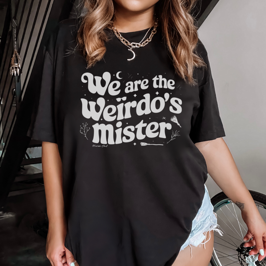 Front view of The Craft movie witchy quote tee for women, featuring "We are the weirdo's Mister" and witchy elements.
